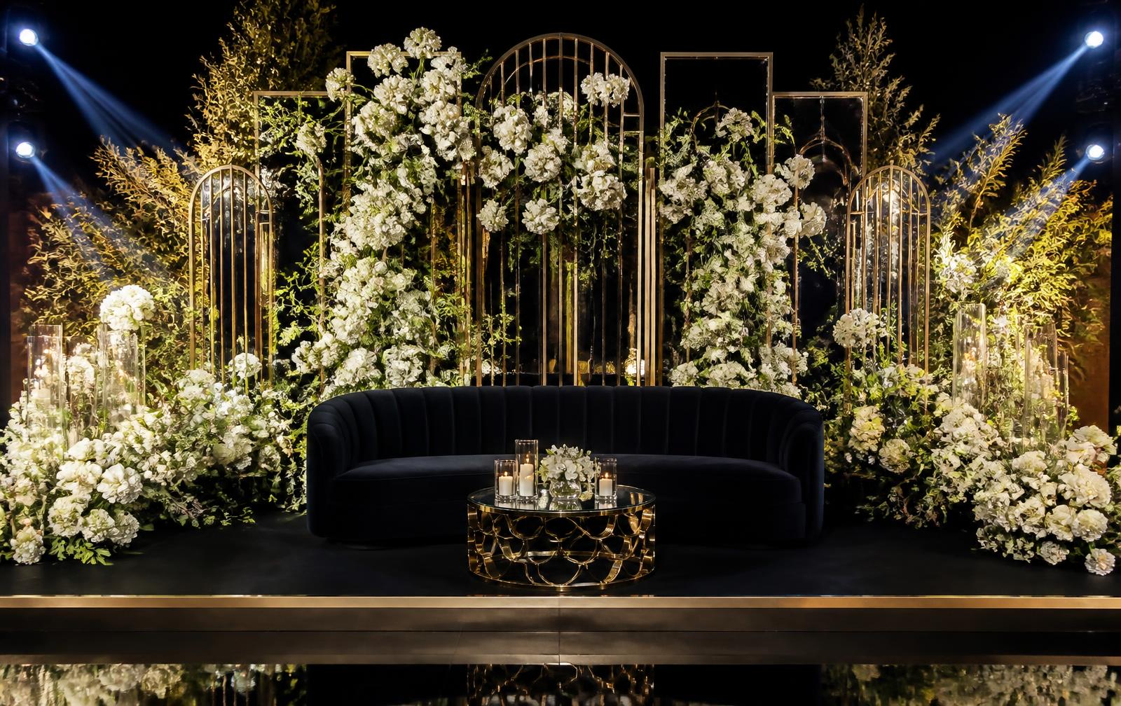 Floral reception stage with velvet lounge
